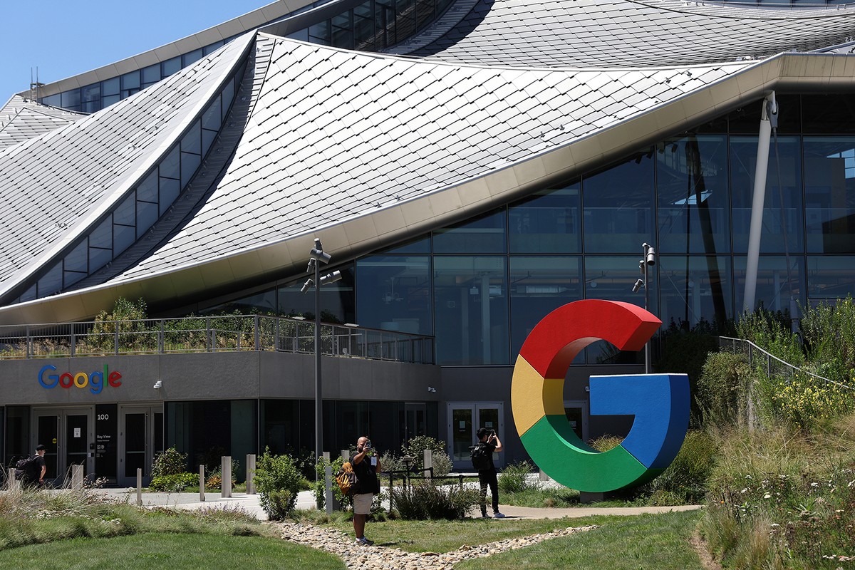 The Google logo is displayed in front of company headquarters