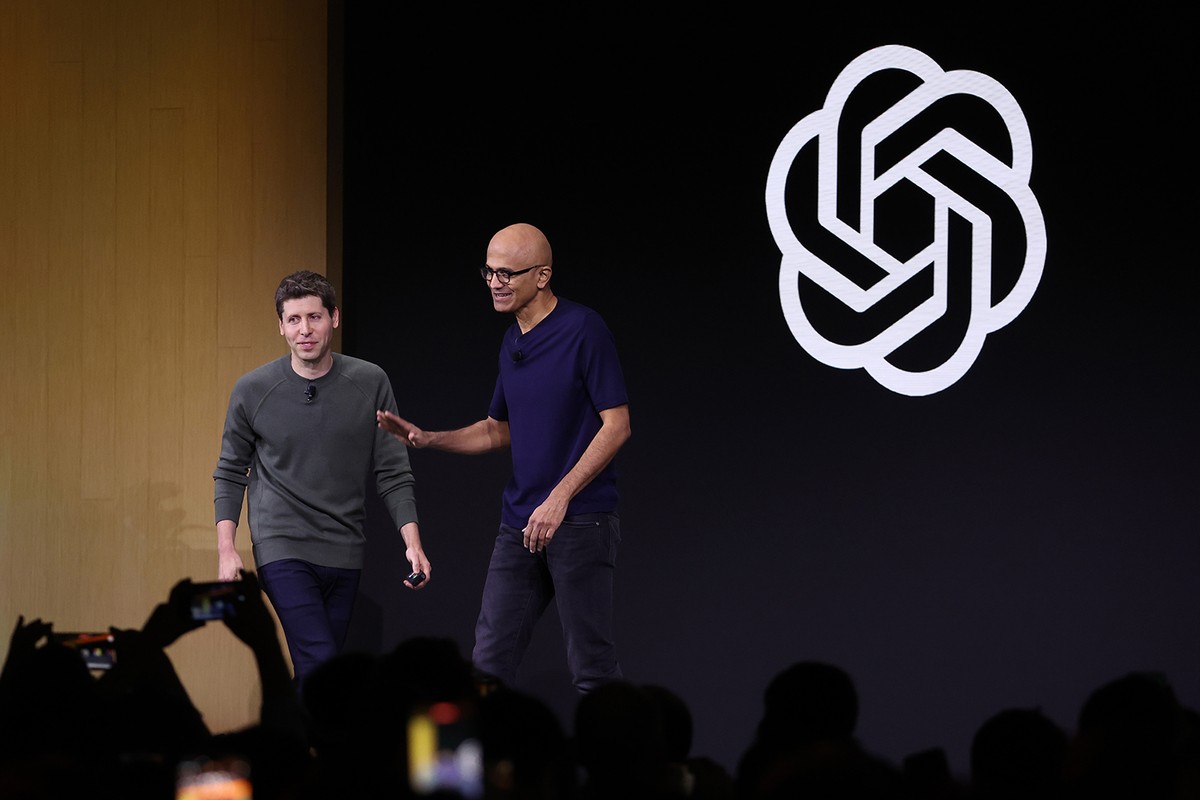 Microsoft CEO Satya Nadella greets OpenAI CEO Sam Altman during the OpenAI DevDay event